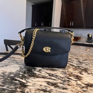 Black Coach Cassie 19 crossbody bag in black leather.